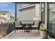 Relaxing porch with comfortable seating, area rug, and view of the neighborhood at 11103 Cloud Shadow St, Littleton, CO 80125