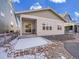 A cozy backyard featuring a covered patio and manicured gravel landscaping at 8894 River Peak Cir, Littleton, CO 80125