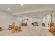 Finished basement with versatile space for seating, dining, and exercise equipment at 8894 River Peak Cir, Littleton, CO 80125