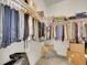 Well-organized walk-in closet with ample hanging space and shelving at 8894 River Peak Cir, Littleton, CO 80125