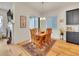 Dining room with hardwood floors and a wooden table and chairs at 8894 River Peak Cir, Littleton, CO 80125