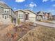 A inviting single-Gathering home, features a landscaped front yard and a spacious two-car garage at 8894 River Peak Cir, Littleton, CO 80125