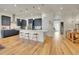 Elegant kitchen featuring a large island, modern appliances, and seamless flow into the entryway at 8894 River Peak Cir, Littleton, CO 80125
