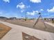 Community playground with slides, swings, and climbing structures for children in a Gathering-friendly environment at 8894 River Peak Cir, Littleton, CO 80125