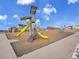 A brightly colored, safe playground with climbing structures, slides, and soft ground cover for neighborhood children at 8894 River Peak Cir, Littleton, CO 80125