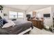 Spacious bedroom features natural light, a window, brick wall, and plenty of room at 7925 W Layton Ave # 529, Littleton, CO 80123