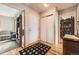 Inviting entryway with wood floors, coat closet, and access to living spaces at 7925 W Layton Ave # 529, Littleton, CO 80123