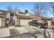 Charming townhome featuring a two-car garage and well-maintained landscaping at 7925 W Layton Ave # 529, Littleton, CO 80123
