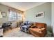 Comfortable living room with two chairs, a window, and a picture on the wall at 7925 W Layton Ave # 529, Littleton, CO 80123