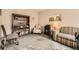Cozy living room with a bookshelf, comfortable seating, and natural light for relaxation at 7925 W Layton Ave # 529, Littleton, CO 80123