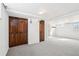 Finished basement featuring dark wood-tone storage and neutral carpeting at 922 Pratt St, Longmont, CO 80501