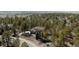 Expansive property nestled among tall pine trees featuring beautiful landscaping and a well-maintained lawn at 5184 Pinyon Jay Rd, Parker, CO 80134