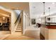 Finished basement features a home theater, a bar area, and a staircase for easy access to other floors at 5184 Pinyon Jay Rd, Parker, CO 80134