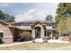 Stunning two-story home featuring a stone facade, arched entryway, and beautifully landscaped front yard at 5184 Pinyon Jay Rd, Parker, CO 80134