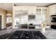 Close-up of kitchen features including gas range, stainless steel appliances, and bar counter with seating at 5184 Pinyon Jay Rd, Parker, CO 80134