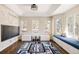 Cheerful playroom featuring large windows, built-in storage, and a playful rug at 5184 Pinyon Jay Rd, Parker, CO 80134
