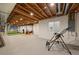 Unfinished basement with exposed beams and a rec space at 7737 Taylor Cir, Larkspur, CO 80118