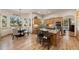 Charming kitchen with custom cabinetry, granite countertops, stainless steel appliances, and bright breakfast nook at 7737 Taylor Cir, Larkspur, CO 80118