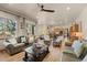 Bright and airy living room with wood floors, neutral decor, and an open floor plan at 7737 Taylor Cir, Larkspur, CO 80118