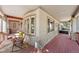 Inviting covered porch with comfortable seating offering a serene outdoor living space at 7737 Taylor Cir, Larkspur, CO 80118