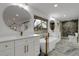 Luxurious bathroom featuring double vanities, a freestanding tub, and a stylish shower at 2961 S Rosemary St, Denver, CO 80231