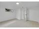 Bedroom featuring neutral carpet, closet storage and a window at 2961 S Rosemary St, Denver, CO 80231