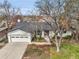 Charming single-story home with a well-maintained lawn and a two-car garage at 2961 S Rosemary St, Denver, CO 80231