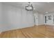 Bright and spacious living room featuring hardwood floors, modern lighting, and freshly painted walls at 2961 S Rosemary St, Denver, CO 80231