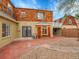 A welcoming outdoor space showcasing the brick patio and unique architectural elements of the home's exterior at 240 Colorado Blvd, Denver, CO 80206