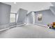 Light-filled upper level bedroom with carpet, closet, and egress to private balcony at 240 Colorado Blvd, Denver, CO 80206