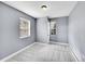 This bedroom features neutral walls, plush carpeting, and ample natural light from multiple windows at 240 Colorado Blvd, Denver, CO 80206