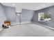 This bedroom features neutral walls, plush carpeting, and multiple windows for natural light at 240 Colorado Blvd, Denver, CO 80206