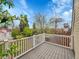 Outdoor deck offers a relaxing retreat with views of a mature trees and the surrounding neighborhood at 240 Colorado Blvd, Denver, CO 80206