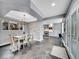 Open concept dining room leads into the kitchen, and features slate flooring at 240 Colorado Blvd, Denver, CO 80206