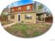Charming two-story home with a unique wood-shingled upper level and inviting covered patio at 240 Colorado Blvd, Denver, CO 80206