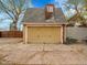 Detached two-car garage with an updated carriage house style door at 240 Colorado Blvd, Denver, CO 80206