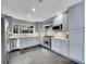 Modern kitchen with stainless steel appliances, light blue cabinets, and sleek countertops at 240 Colorado Blvd, Denver, CO 80206