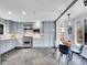 Bright kitchen with stainless steel appliances, tile backsplash, and adjacent breakfast nook at 240 Colorado Blvd, Denver, CO 80206
