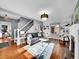Inviting living room with a fireplace, built-in shelving, and staircase at 240 Colorado Blvd, Denver, CO 80206