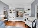 Bright living room with built-in bookshelves and a cozy reading nook at 240 Colorado Blvd, Denver, CO 80206
