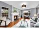 Cozy living room with fireplace, hardwood floors, and plenty of natural light at 240 Colorado Blvd, Denver, CO 80206