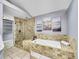 Beautiful main bathroom features a soaking tub, a tiled shower, and modern fixtures at 240 Colorado Blvd, Denver, CO 80206
