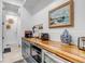 Elegant bar area featuring wood countertops, modern cabinetry, and a stylish painting at 202 October Pl, Castle Rock, CO 80104
