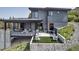 Contemporary home with multiple decks, outdoor seating, and a modern design at 202 October Pl, Castle Rock, CO 80104