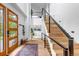Grand foyer with soaring ceilings, modern staircase, and elegant decor creates a welcoming entrance at 202 October Pl, Castle Rock, CO 80104