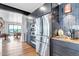 Modern kitchen with stainless steel appliances, views of outdoor scenery and a separate dining room at 202 October Pl, Castle Rock, CO 80104