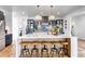 Charming kitchen island with a white countertop and lots of counter seating at 202 October Pl, Castle Rock, CO 80104