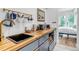 Kitchenette area with wood countertop, gray cabinets, and modern appliances at 202 October Pl, Castle Rock, CO 80104
