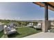 Inviting outdoor seating area on a modern patio with lush, green views at 202 October Pl, Castle Rock, CO 80104