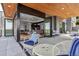 Inviting outdoor patio with comfortable seating and seamless indoor-outdoor flow with large glass doors at 202 October Pl, Castle Rock, CO 80104